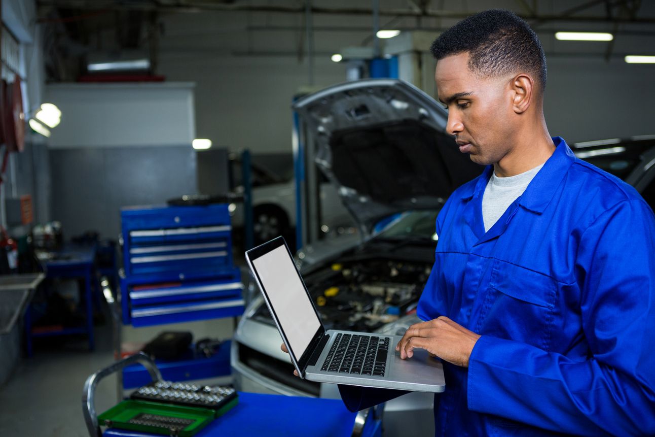 Mechanic working laptop